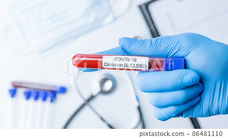 Omicron mutation coronavirus variant. Medical laboratory doctor holding test tube in hospital laboratory. Pandemic prevention. Clinical research. 86481110