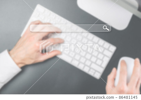 Search advertising. Internet online searching engine selective focus. Hand touching computer for data optimization browser webpage technology internet networking. Blured business concept. 86481145