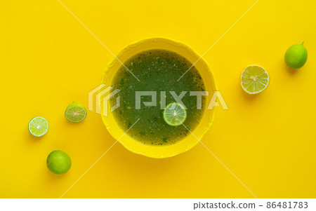 Egyptian Molokhia soup with lime 86481783