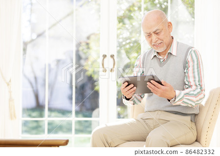 Senior man enjoying nesting and home time Senior man enjoying nesting and home time 86482332