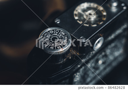 Soviet old film camera with manual lens. Retro photo equipment. Selective focus 86482628