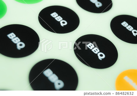 BBQ sticker, a self-adhesive label on a paper substrate. Print labels on a roll machine in a printing house. Selective focus BBQ sticker, a self-adhesive label on a paper substrate. Print labels on a roll machine in a printing house. Selective focus 86482632