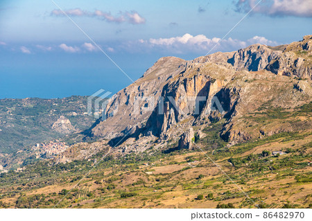 View of Rocche del Crasto near Alcara Li Fusi town in the Nebrodi Park, Sicily View of Rocche del Crasto near Alcara Li Fusi town in the Nebrodi Park, Sicily 86482970