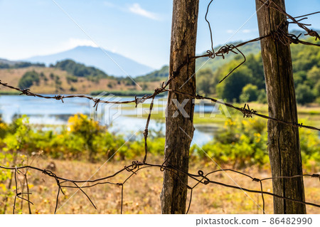 View of Biviere lake with Etna volcano, Nebrodi National Park, Sicily, Italy View of Biviere lake with Etna volcano, Nebrodi National Park, Sicily, Italy 86482990