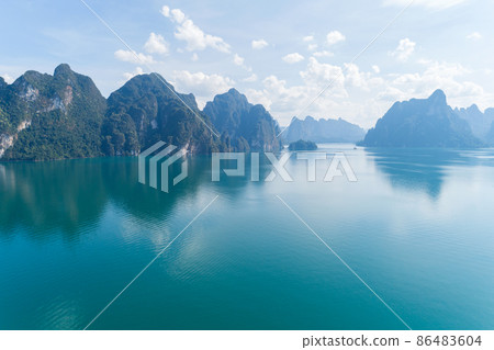 Aerial drone view of tropical Mountain peak in Thailand Beautiful archipelago islands Thailand Scenic mountains on the lake in Khao Sok National Park amazing nature landscape 86483604