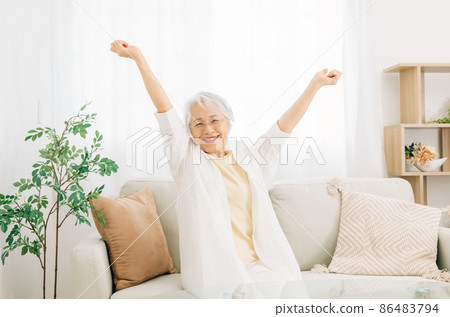 Elderly woman relaxing Elderly woman relaxing 86483794