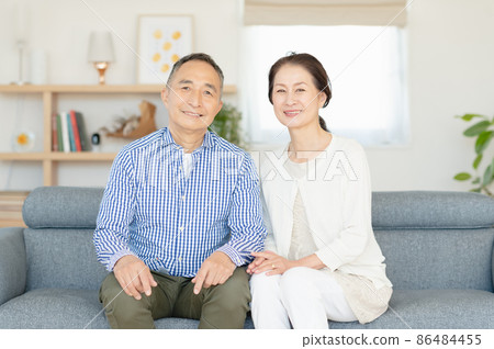 Senior couple relaxing on the sofa Senior couple relaxing on the sofa 86484455