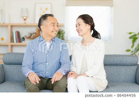 Senior couple relaxing on the sofa Senior couple relaxing on the sofa 86484456