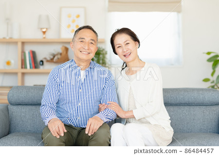 Senior couple relaxing on the sofa Senior couple relaxing on the sofa 86484457