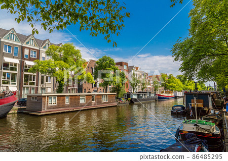 Amsterdam canals and boats, Holland, Netherlands. Amsterdam canals and boats, Holland, Netherlands. 86485295