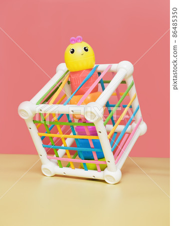 early childhood development, Montessori method. children's toys. kindergarten sorter. Logical and educational toys, red background 86485350