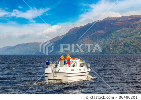 Boat on the Loch Ness lake in Scotland Boat on the Loch Ness lake in Scotland 86486201