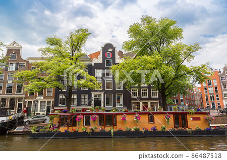 Amsterdam canals and  boats, Holland, Netherlands. 86487518