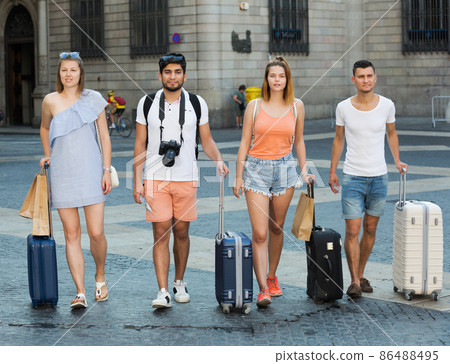 People taking promenade with suitcases People taking promenade with suitcases 86488495