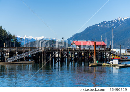 West Vancouver, BC, Canada - April 13 2021 : Horseshoe Bay Public Dock in springtime. West Vancouver, BC, Canada - April 13 2021 : Horseshoe Bay Public Dock in springtime. 86490829