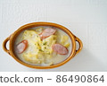 Delicious Chinese cabbage and sausage in cream in the cold winter 86490864
