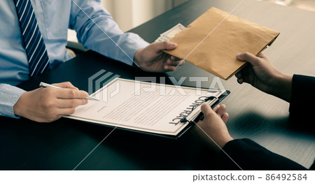 Corruption. Businessmen make an agreement with the money proposed his partner to bribe in the office and make a contract under an agreement. Illegal money fraud The concept of bribery and corruption 86492584