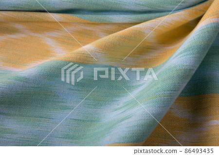Close up of texture of hand woven cotton cloth Close up of texture of hand woven cotton cloth 86493435