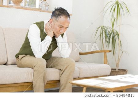 Senior man thinking alone in the living room 86494813
