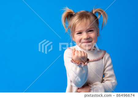 Naughty little girl over the blue background 86496674