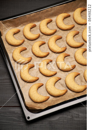 Baking tray with traditional German or Austrian Vanillekipferl vanilla kipferl cookies Baking tray with traditional German or Austrian Vanillekipferl vanilla kipferl cookies 86498212