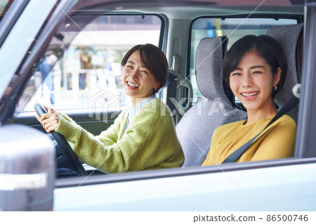 Female driving a passenger car Female driving a passenger car 86500746