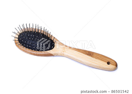 Wooden comb isolated on a white background Wooden comb isolated on a white background 86501542