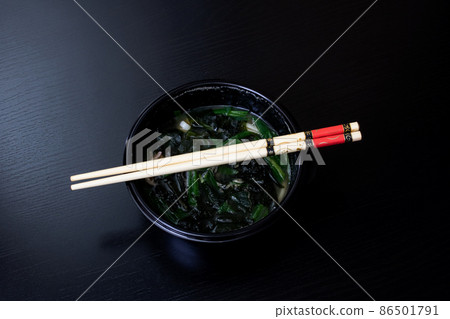 Japanese soup and sticks on wooden table Japanese soup and sticks on wooden table 86501791