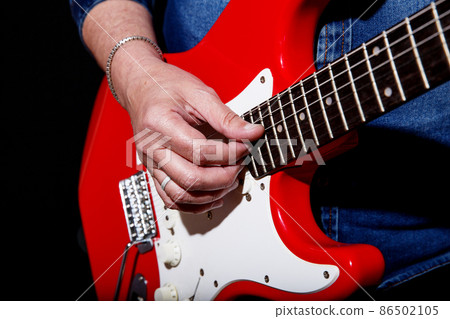 man plays the electric guitar man plays the electric guitar 86502105