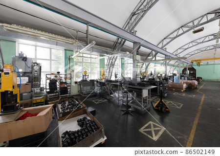 Photo of modern automobile manufacturing workshop. Factory with steel constructions. Plant concept 86502149