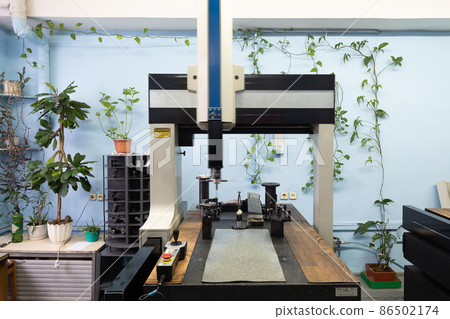 Photo of modern automatic automobile manufacturing workshop. Car production. Industrial scenery Photo of modern automatic automobile manufacturing workshop. Car production. Industrial scenery 86502174