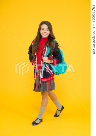 go to school. travel concept. small girl uniform hold go to school. travel concept. small girl uniform hold 86502762
