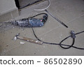 Hammer, chisel and electric drill lying on the tile floor. Renovation. Home improvement. Do It Yourself apartment repairing.  86502890
