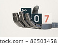 robots hand holds cubes with the date February 07. close-up, selective focus. World Robotics Day 86503458
