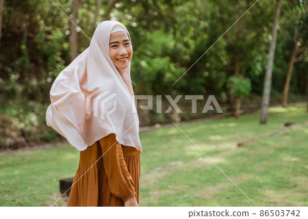 attractive muslim asian woman wearing scarf outdoor attractive muslim asian woman wearing scarf outdoor 86503742