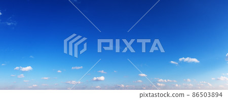 Clear blue sky with small clouds in summer day 86503894
