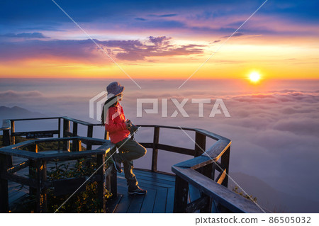 Tourist enjoying sunset at Kew Mae Pan viewpoint in Doi inthanon, Chiang Mai, Thailand. 86505032