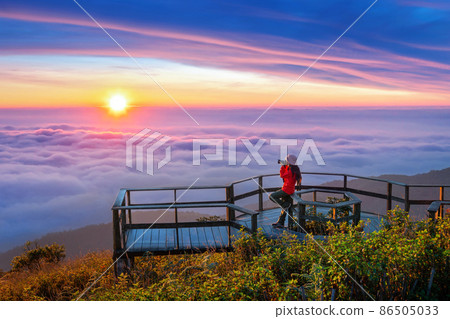 Tourist enjoying sunset at Kew Mae Pan viewpoint in Doi inthanon, Chiang Mai, Thailand. 86505033