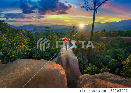 Young man trekking along Pai canyon in Mae hong son province, Thailand. Adventure, trekking and trail concept. 86505322