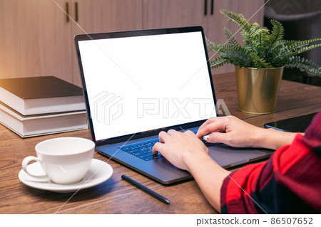 Woman working on laptop with white screen. Work from home. Woman working on laptop with white screen. Work from home. 86507652