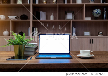 Laptop with white screen on the table. Work from home. Laptop with white screen on the table. Work from home. 86507653