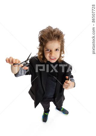Portrait of liitle boy, kid in image of stylish hairdresser, barber isolated on white studio background. Concept of occupation, modern specialists, childhood Portrait of liitle boy, kid in image of stylish hairdresser, barber isolated on white studio background. Concept of occupation, modern specialists, childhood 86507728