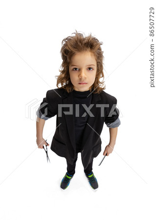 Stylish hairdresser. Portrait of liitle boy, kid in image of barber isolated on white studio background. Concept of occupation, modern specialists, childhood 86507729