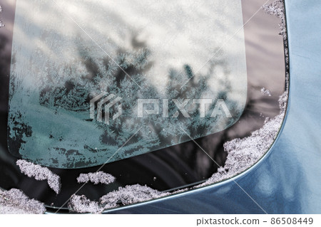 hoarfrost on car window glass at daylight close-up with selective focus 86508449
