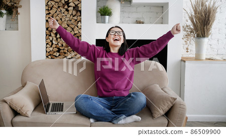 Excited asian girl winner with laptop computer, screaming yes and celebrating mobile online game victory success or getting ecommerce shopping offer. Startup business and mobile technology concept Excited asian girl winner with laptop computer, screaming yes and celebrating mobile online game victory success or getting ecommerce shopping offer. Startup business and mobile technology concept 86509900