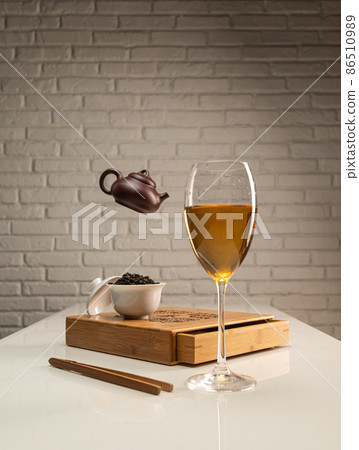 tea table with appliances and wine glasses, in which large-leaf tea is brewed tea table with appliances and wine glasses, in which large-leaf tea is brewed 86510989