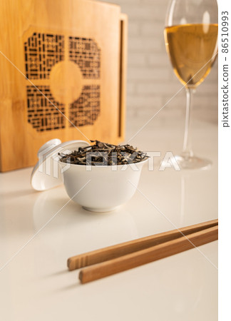 tea table with appliances and wine glasses, in which large-leaf tea is brewed 86510993