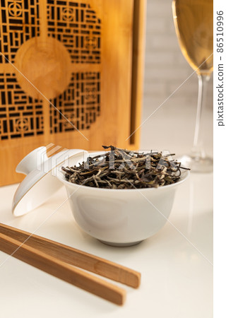 tea table with appliances and wine glasses, in which large-leaf tea is brewed 86510996