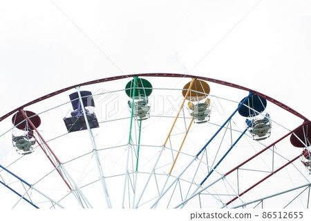Ferris wheel in an amusement park Ferris wheel in an amusement park 86512655