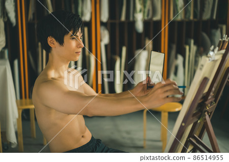 A man drawing a self-portrait A man drawing a self-portrait 86514955